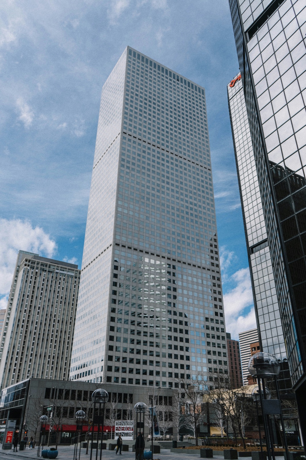 Glass office tower rising above the city